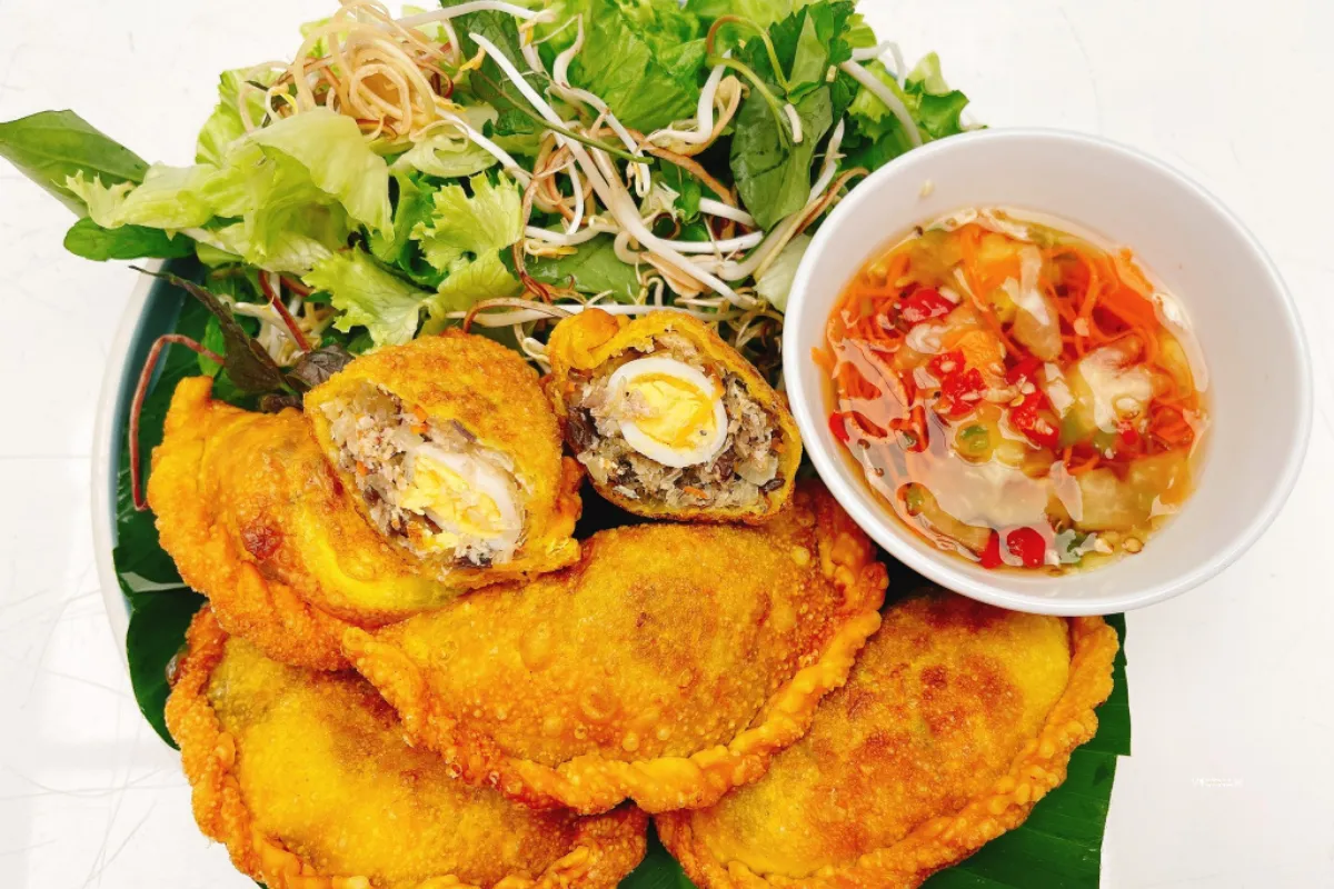 Exclusive Hanoi Street Food Tour | Discover Hanoi’s Best Eats on Foot Banh goi Hanoi crispy fried pillow cake