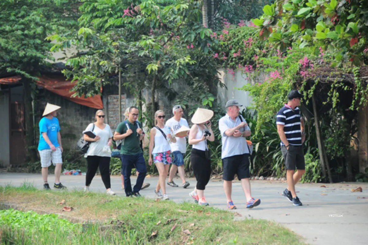 Authentic Hanoi Day Tour | Incense Village & Duong Lam Ancient Village Visitors exploring Duong Lam ancient village