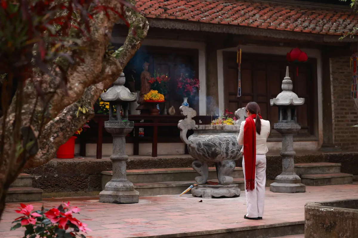 Authentic Hanoi Day Tour | Incense Village & Duong Lam Ancient Village Visitors praying at Tay Phuong Pagoda